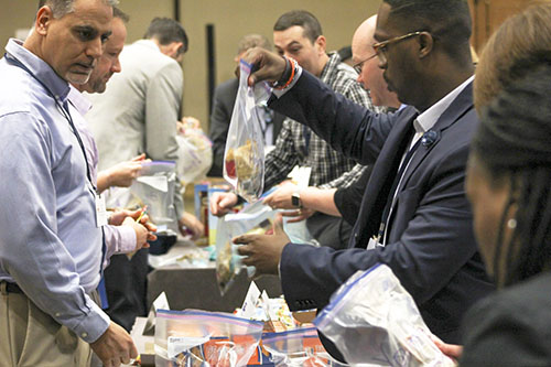 Poverty Simulation that United Way does with people sorting through food