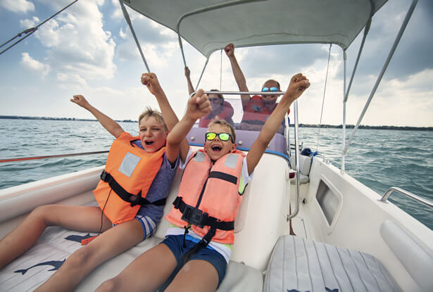 family having fun on boat